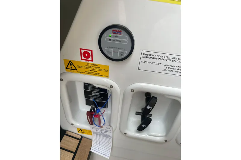 Slide: The Image of Control panel on a 2017 Jeanneau Leader 46 boat with safety warnings and compliance label. - 68