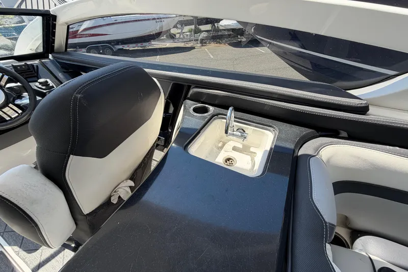 Slide: The Image of Interior of 2020 Yamaha Boats 275SD featuring a sleek sink and seating area. - 11