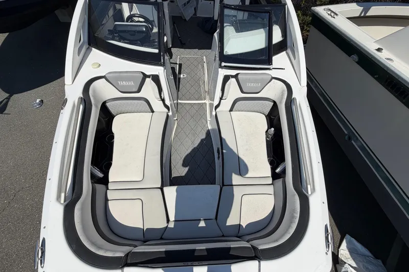 Slide: The Image of 2020 Yamaha Boats 275SD interior with seating and steering wheel, top view. - 16
