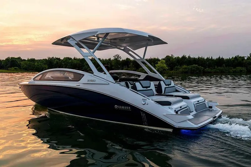 Slide: The Image of Manufacturer Provided Image: 2020 Yamaha Boats 275SD cruising on a serene lake at sunset. - 2