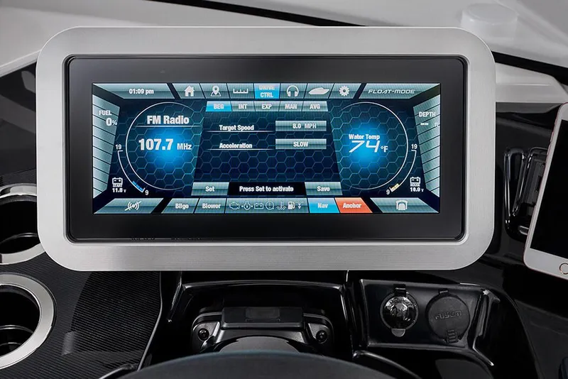 Slide: The Image of Manufacturer Provided Image: Dashboard display of 2020 Yamaha Boats 275SD showing FM radio and water temperature. - 8