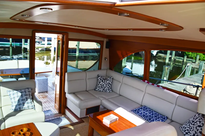 Slide: The Image of Luxurious interior of 2020 Palm Beach Motor Yachts PB52 with elegant seating and waterfront view. - 19