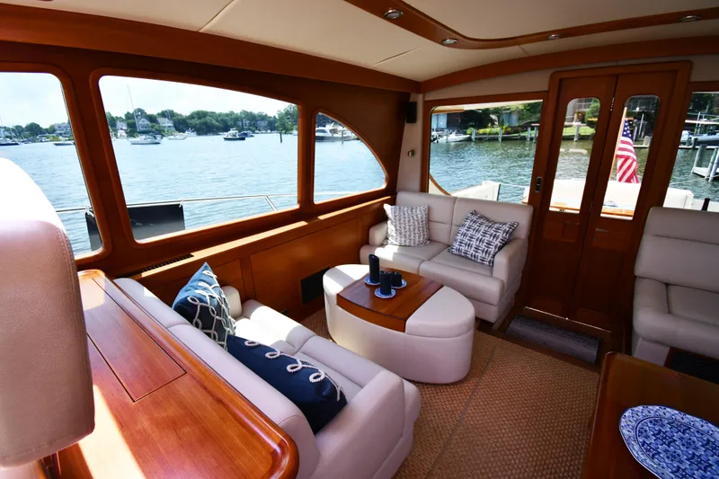 Slide: The Image of Luxurious interior of 2020 Palm Beach Motor Yachts PB52 with elegant seating and scenic water view. - 22