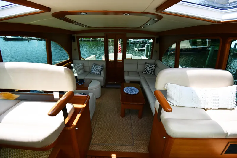 Slide: The Image of Luxurious interior of 2020 Palm Beach Motor Yachts PB52 with elegant seating and waterfront view. - 24