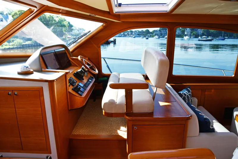 Slide: The Image of Luxurious 2020 Palm Beach Motor Yachts PB52 interior with elegant wood finish and waterfront view. - 28