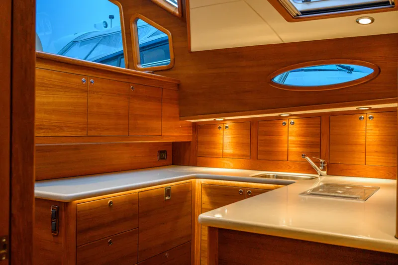 Slide: The Image of Luxurious 2020 Palm Beach Motor Yachts PB52 interior with elegant wood cabinetry and modern fixtures. - 36