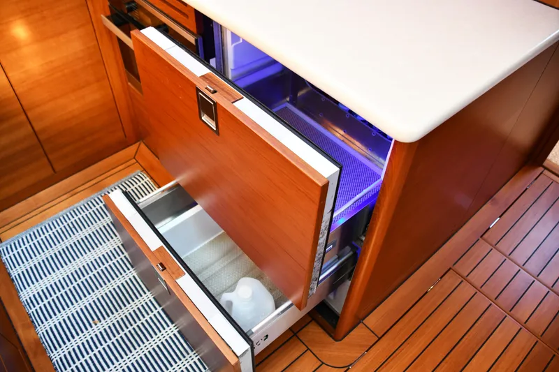 Slide: The Image of 2020 Palm Beach Motor Yachts PB52 interior with open wooden drawers and modern design. - 38
