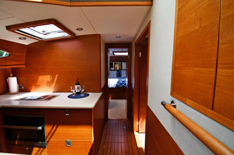 Slide: The Image of Luxurious interior of 2020 Palm Beach Motor Yachts PB52, featuring elegant wood finishes and modern amenities. - 39