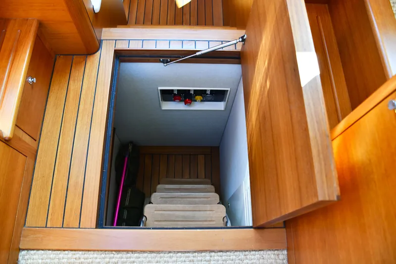 Slide: The Image of 2020 Palm Beach Motor Yachts PB52 interior with wooden hatch and stairs. - 40