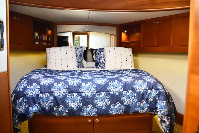 Slide: The Image of Luxurious cabin interior of 2020 Palm Beach Motor Yachts PB52 with floral bedding. - 41