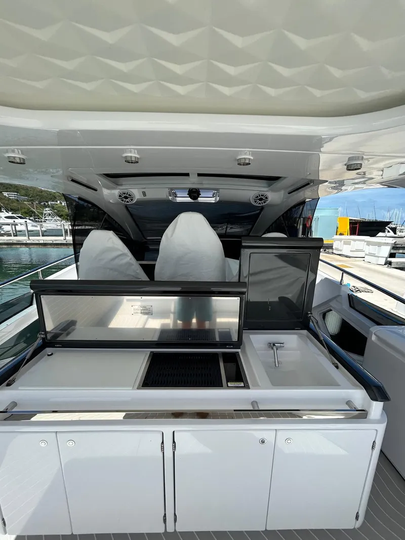 Slide: The Image of 2024 Azimut Verve 48 yacht interior with sleek kitchen and modern design. - 13