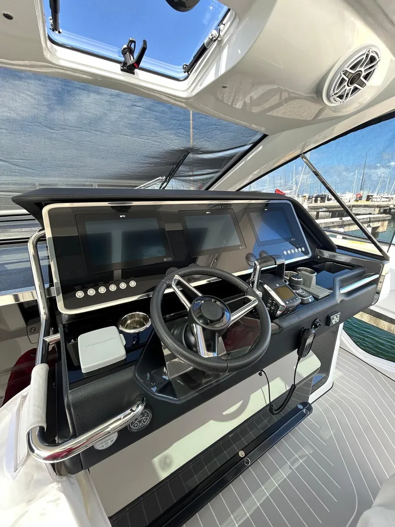 Slide: The Image of 2024 Azimut Verve 48 helm with modern navigation controls and sleek design. - 15
