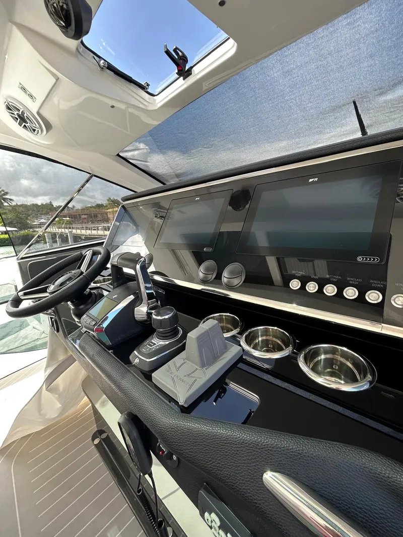 Slide: The Image of 2024 Azimut Verve 48 helm with advanced navigation controls and sleek dashboard design. - 16