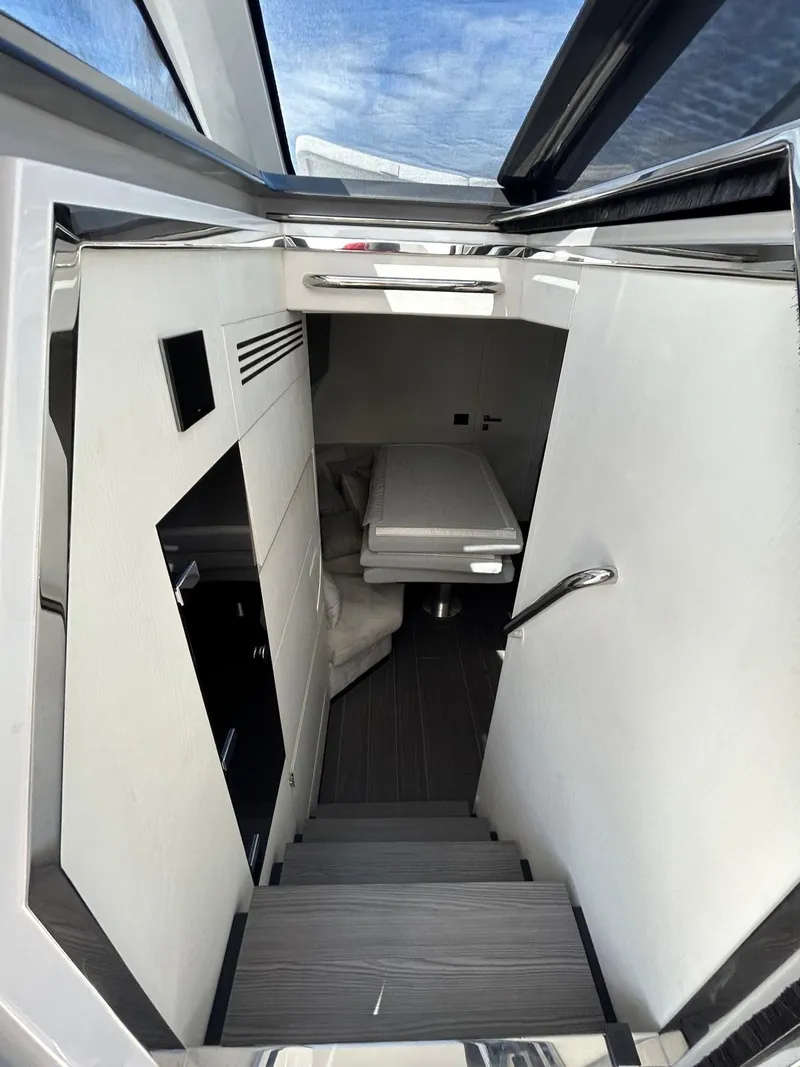 Slide: The Image of 2024 Azimut Verve 48 interior with modern design and sleek staircase. - 17