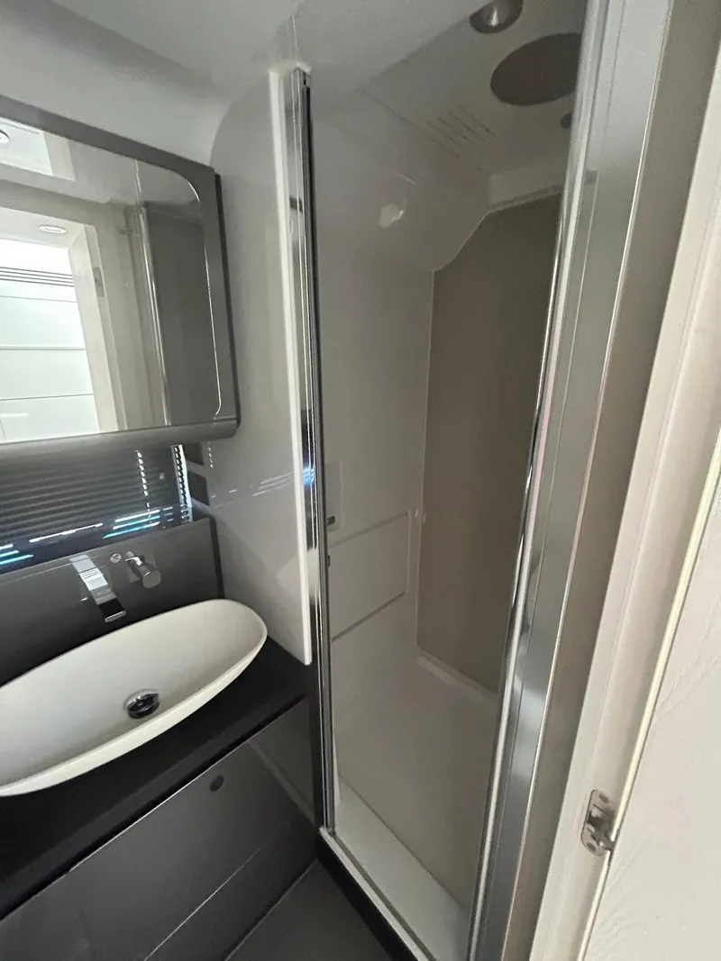 Slide: The Image of Modern bathroom in 2024 Azimut Verve 48 yacht with sleek shower and basin. - 24