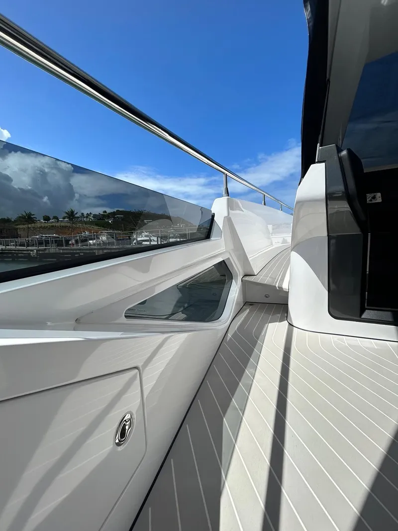 Slide: The Image of 2024 Azimut Verve 48 yacht deck with sleek design and clear blue sky. - 9