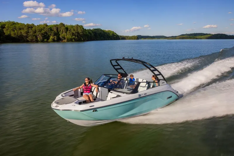 Slide: The Image of 2026 Yamaha Boats 222S cruising on a scenic lake with passengers enjoying the ride. - 11