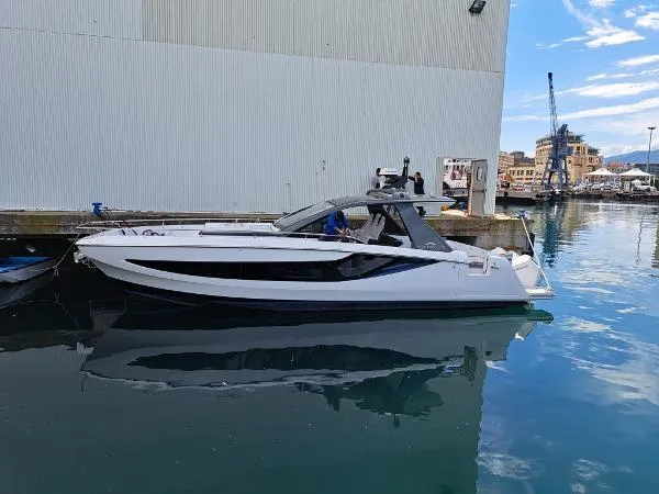 The Image of 2024 Azimut Verve 42 yacht docked in a marina, reflecting on calm water. - 0