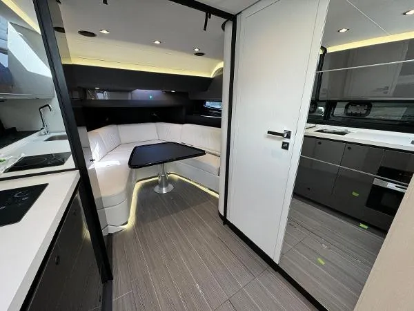Slide: The Image of Modern interior of 2024 Azimut Verve 42 yacht with sleek kitchen and dining area. - 11