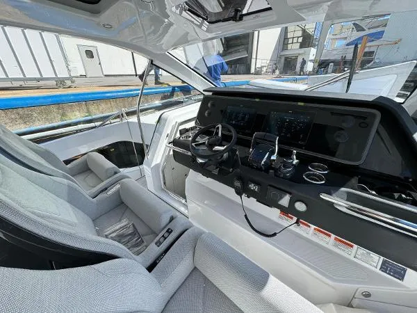 Slide: The Image of 2024 Azimut Verve 42 yacht cockpit with modern controls and luxurious seating. - 8