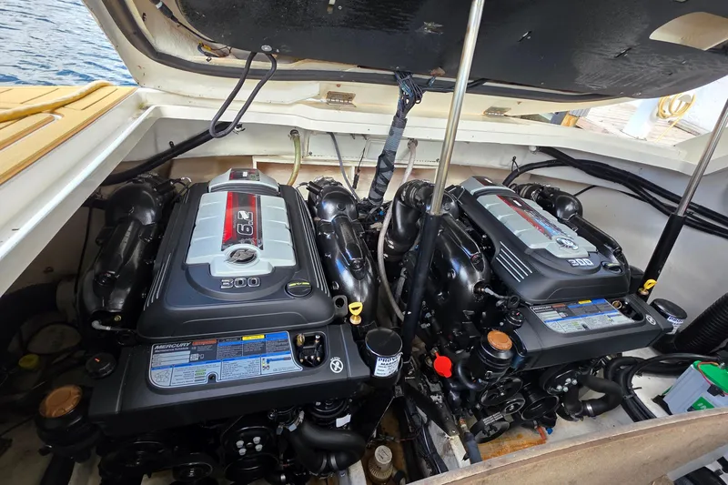Slide: The Image of Twin Mercury engines in a 2015 Sea Ray SLX 350 boat engine compartment. - 11