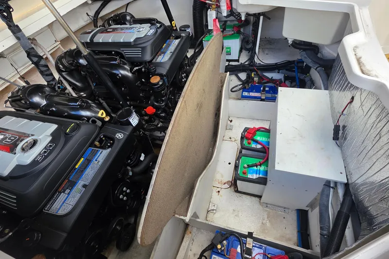 Slide: The Image of Engine compartment of a 2015 Sea Ray SLX 350 with dual engines and batteries. - 13