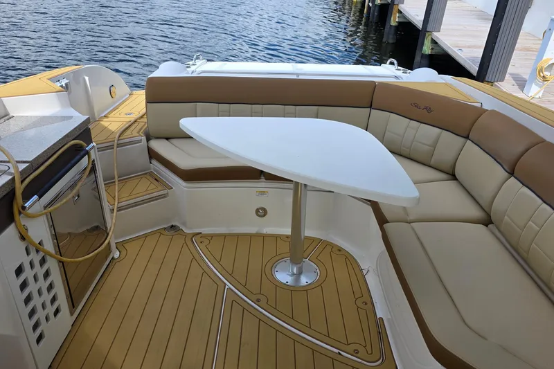 Slide: The Image of Luxurious 2015 Sea Ray SLX 350 boat interior with elegant seating and table. - 25