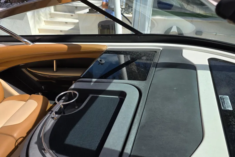 Slide: The Image of Interior view of a 2015 Sea Ray SLX 350 boat with tan seating. - 26