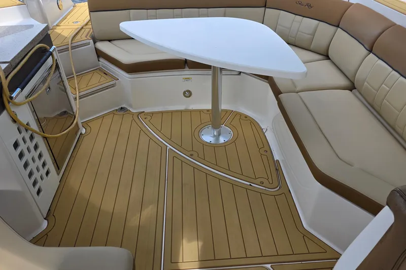 Slide: The Image of Luxurious 2015 Sea Ray SLX 350 boat interior with elegant seating and table. - 27