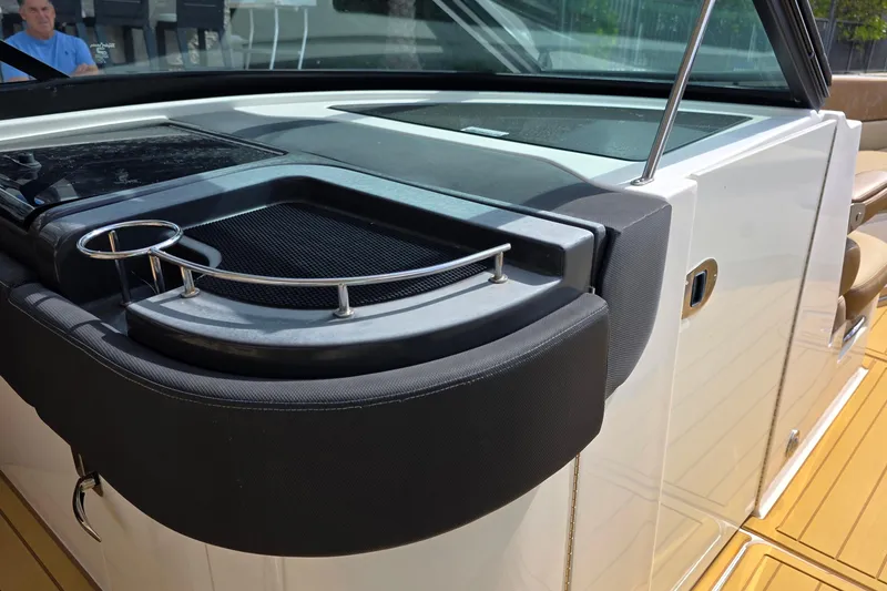 Slide: The Image of 2015 Sea Ray SLX 350 boat interior with cup holder and sleek design. - 30