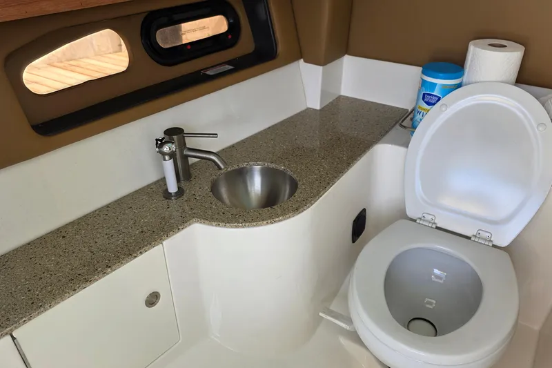Slide: The Image of Bathroom interior of 2015 Sea Ray SLX 350 boat with sink and toilet. - 31
