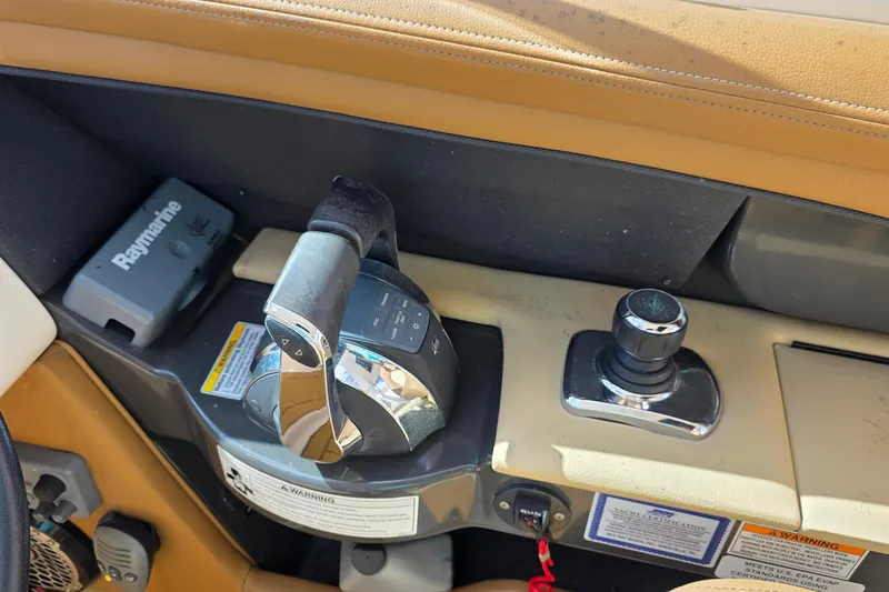 Slide: The Image of Control panel of a 2015 Sea Ray SLX 350 boat with Raymarine equipment. - 32