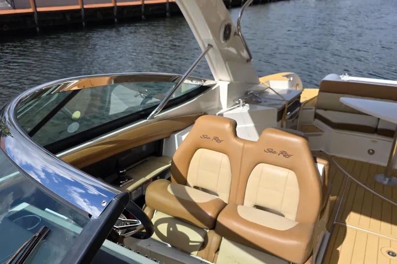 Slide: The Image of 2015 Sea Ray SLX 350 boat interior with tan seating and sleek design. - 37