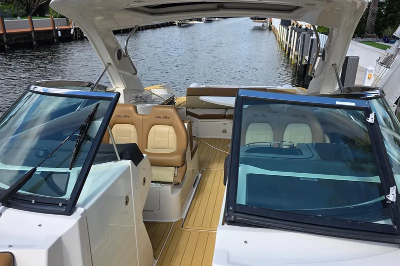 Slide: The Image of 2015 Sea Ray SLX 350 boat interior with tan seating and open deck view. - 41