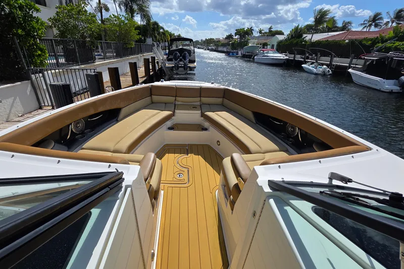 Slide: The Image of 2015 Sea Ray SLX 350 boat with spacious seating on a sunny canal. - 44