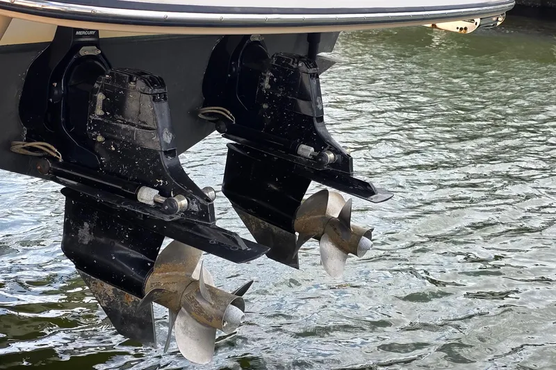 Slide: The Image of Twin propellers of a 2015 Sea Ray SLX 350 boat in water. - 47