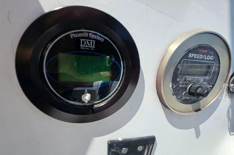 Slide: The Image of Instrumentation panel on a 1979 Morgan 382 sailboat featuring Phoenix System and Speed/Log gauges. - 23