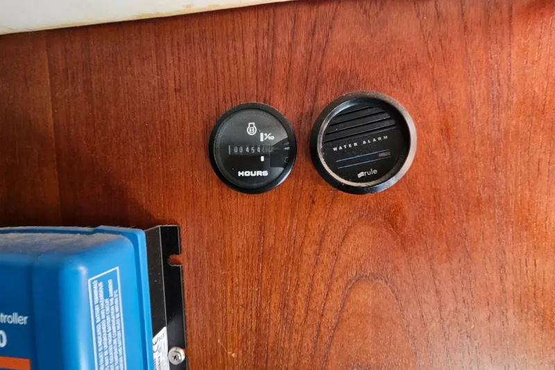 Slide: The Image of Hour meter and water alarm on 1979 Morgan 382 boat dashboard. - 31