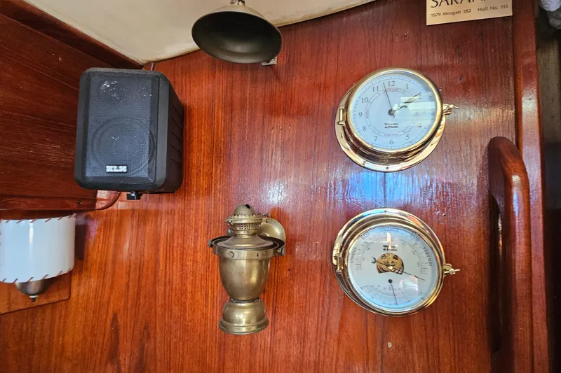 Slide: The Image of Interior of a 1979 Morgan 382 yacht with brass instruments and speaker on wooden panel. - 38