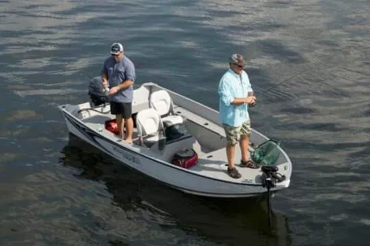 Slide: The Image of Manufacturer Provided Image: 2026 Smoker Craft Angler 16 SC boat with two people fishing on calm water. - 23