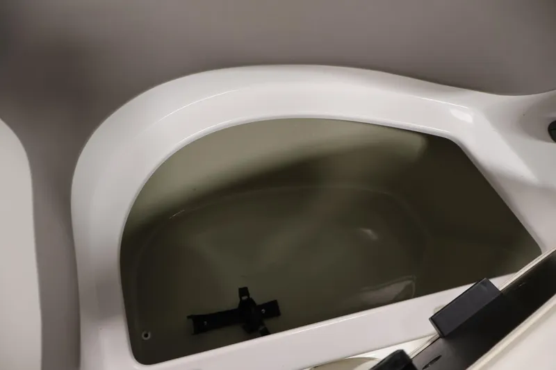 Slide: The Image of Storage compartment of 2011 Sea-Doo Challenger 180 boat, featuring sleek white interior design. - 13