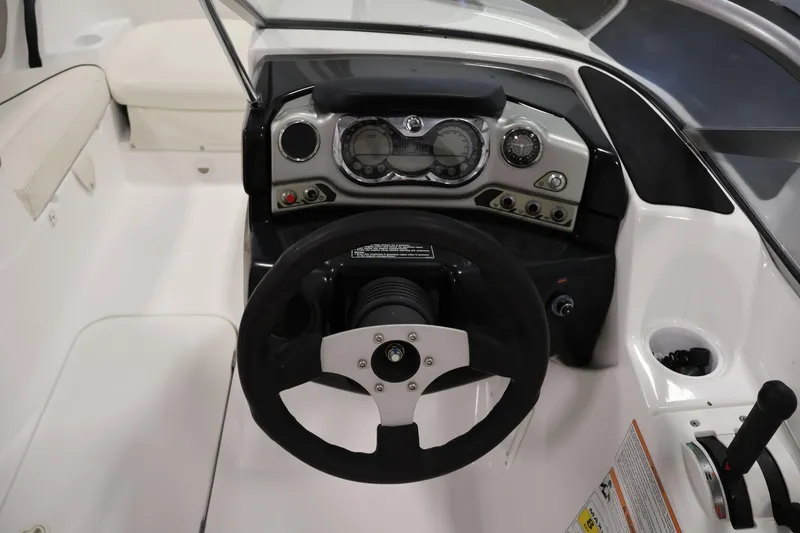 Slide: The Image of 2011 Sea-Doo Challenger 180 dashboard with steering wheel and control panel. - 17