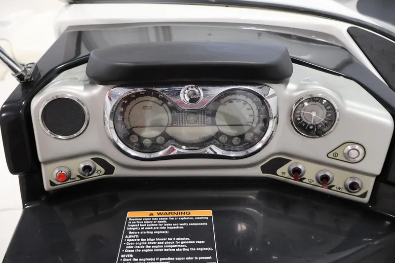 Slide: The Image of Dashboard of a 2011 Sea-Doo Challenger 180 boat with gauges and controls. - 19