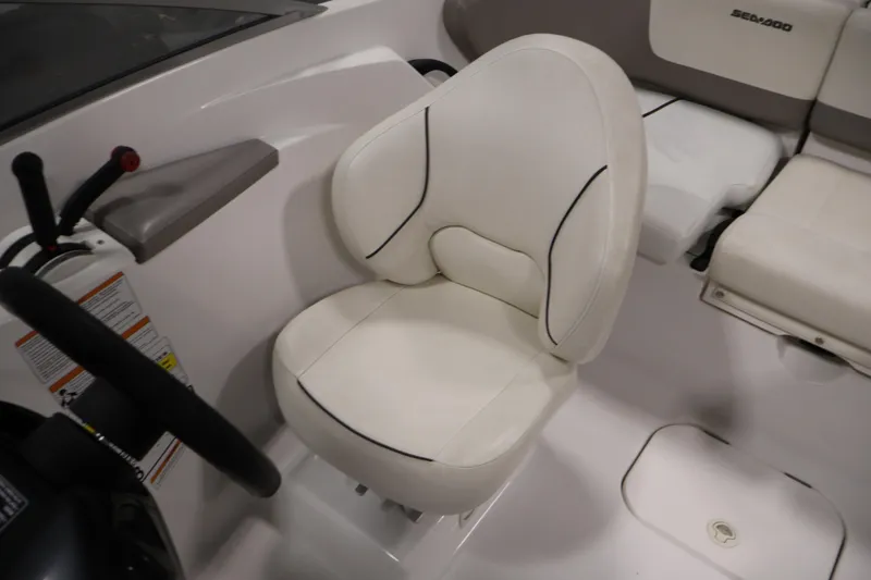 Slide: The Image of 2011 Sea-Doo Challenger 180 interior with white seating and steering wheel. - 21
