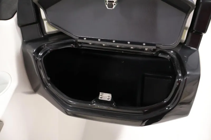 Slide: The Image of Open storage compartment of 2011 Sea-Doo Challenger 180 boat, showcasing interior space. - 23
