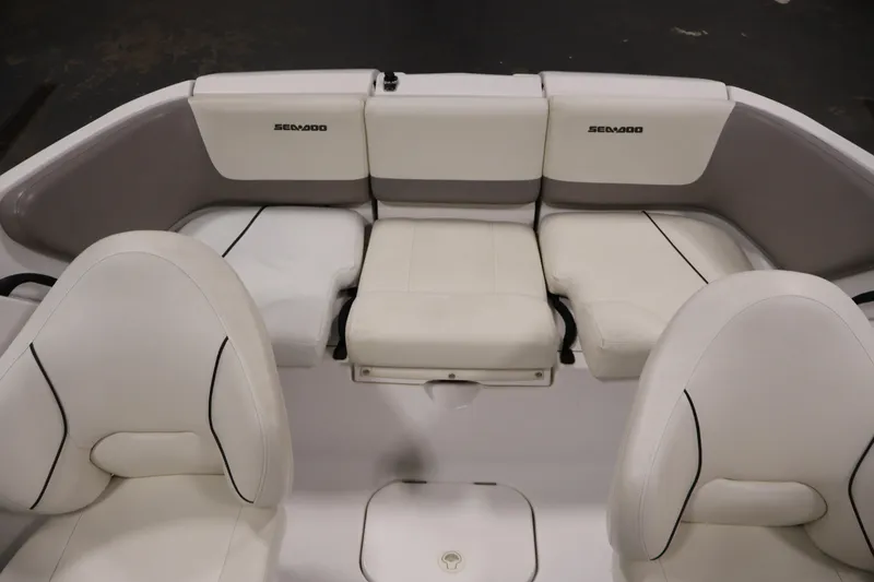 Slide: The Image of 2011 Sea-Doo Challenger 180 boat interior with white seating and Sea-Doo branding. - 27