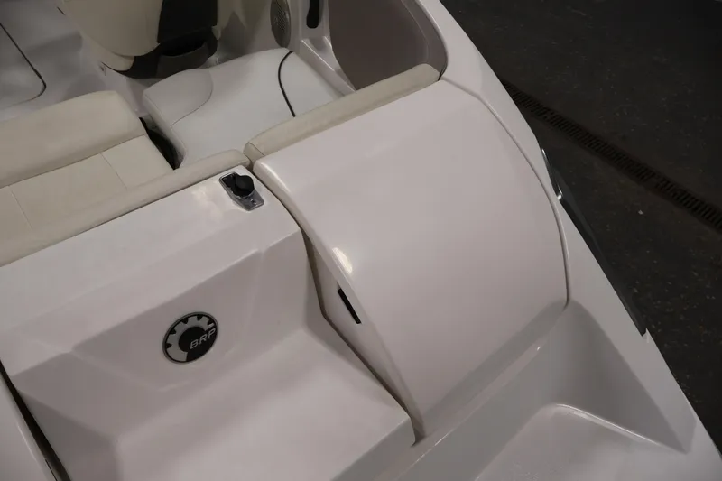 Slide: The Image of 2011 Sea-Doo Challenger 180 boat interior with white seating and BRP logo. - 30