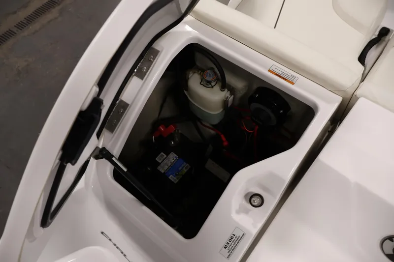 Slide: The Image of 2011 Sea-Doo Challenger 180 engine compartment with battery and components. - 31