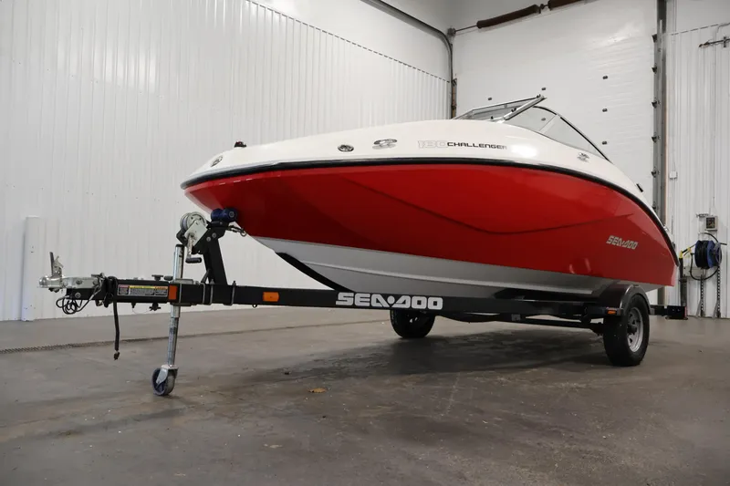 Slide: The Image of 2011 Sea-Doo Challenger 180 boat on trailer in indoor storage facility. - 34