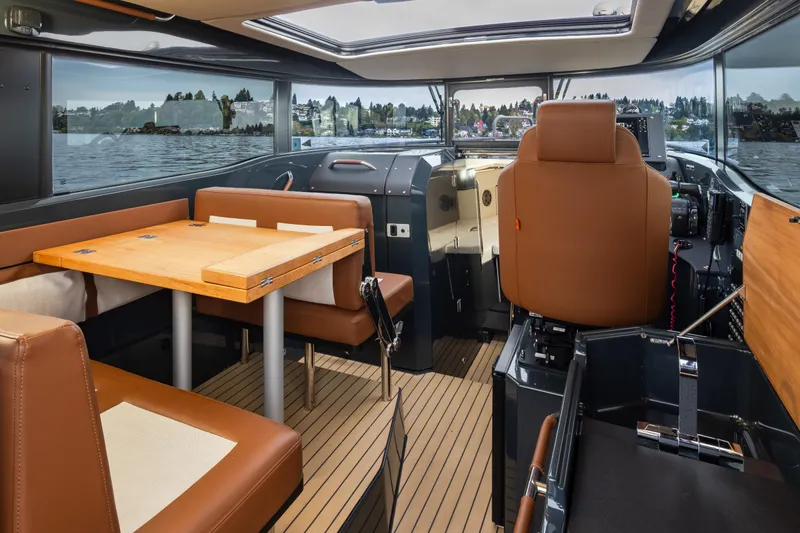 Slide: The Image of Interior of 2023 Arksen 30 Adventure boat with seating and navigation area. - 11
